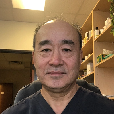 Chiropractor Lei Zhang In Black Scrubs